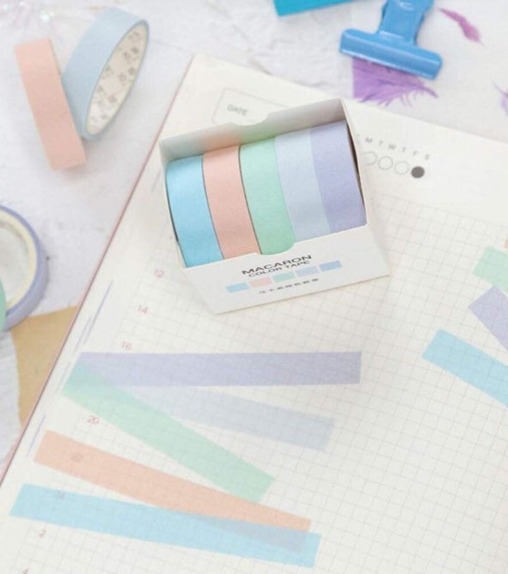 the drizzle washi tape 5 pack placed next to samples of the 5 different washi tapes