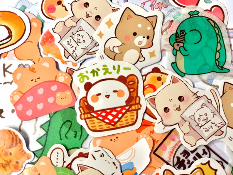 a range of different sticker flakes, featuring a panda sticker, a dinosaur sticker, a fox sticker, a cat sticker and more