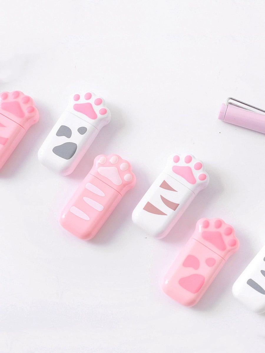 alternating pink and white cat paw correction tapes in a line